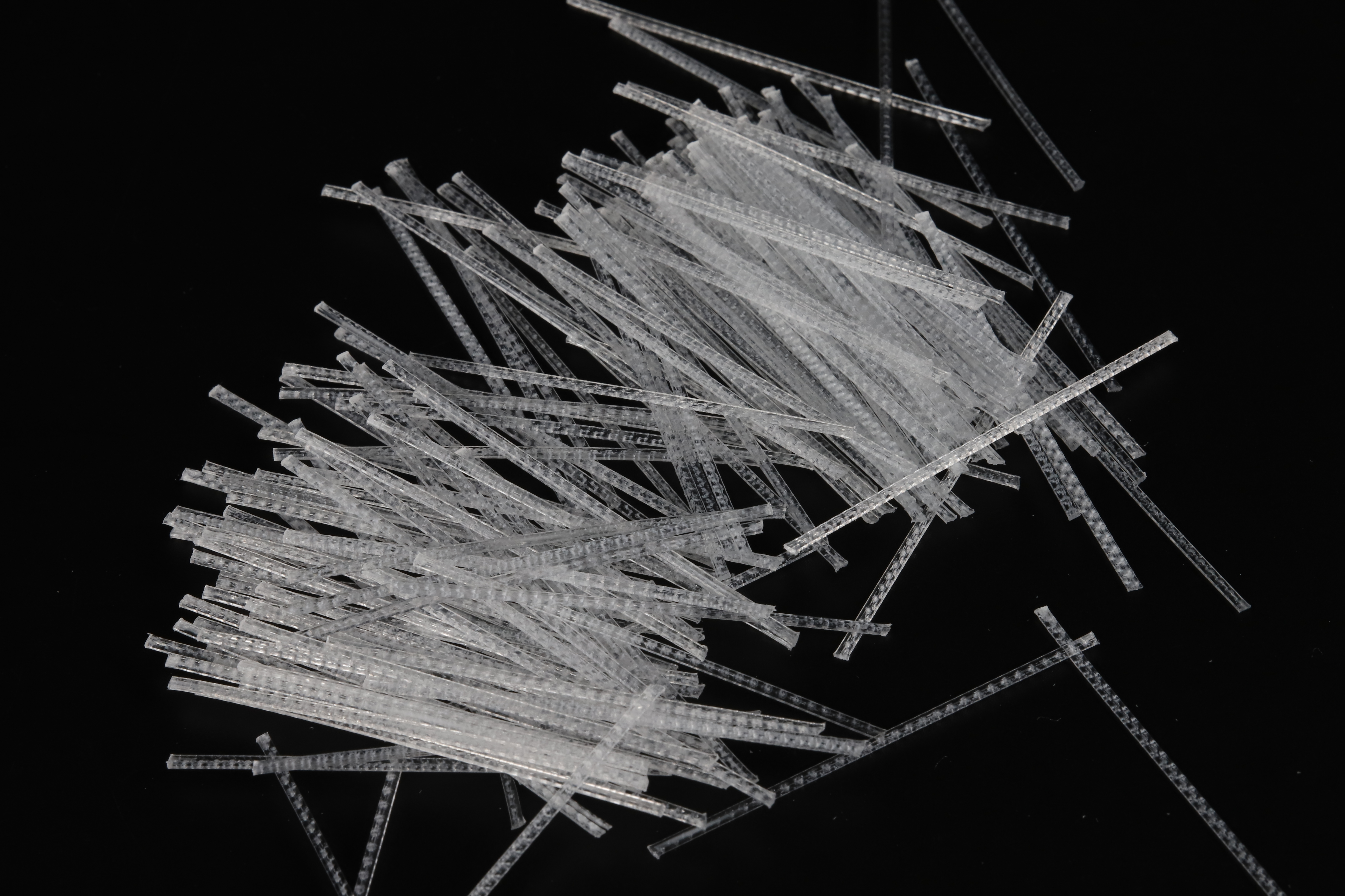 Macrofiber embossed transparent